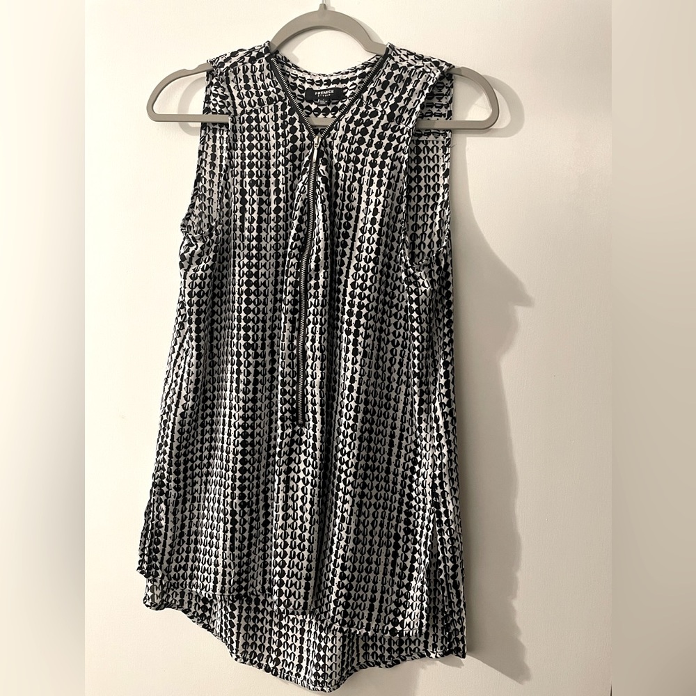 Premise Studio- classic, stylish, and chic, sleeveless zip-up blouse.